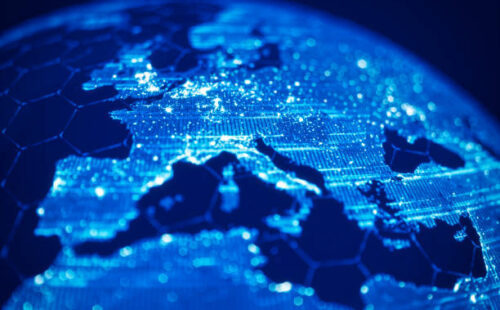 Blue futuristic globe with hexagonal grids and light beams.