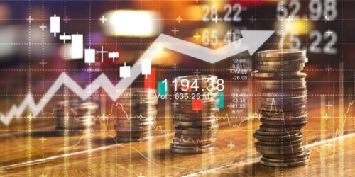 Finance and business concept. Investment graph and rows growth and of coins on table